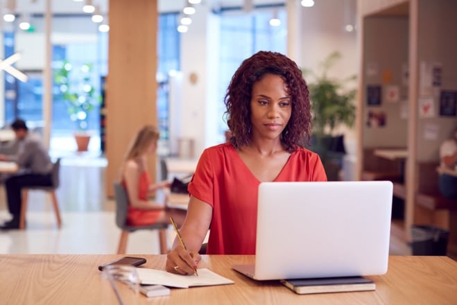 Businesswoman at desk in modern workspace