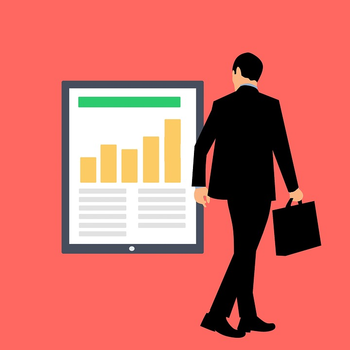 business man in suit reviewing financial statement